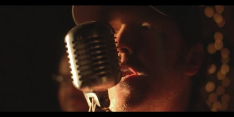 Country singer closeup singing into a microphone